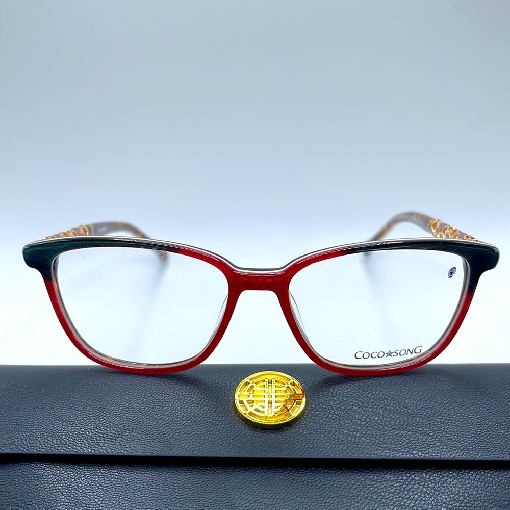 NWOT. Coco Song women’s Optical frames. Blue feathers over red silk.